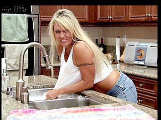 Stunning cougar soaks herself on the kitchen counter coupled with rubs her wet fist